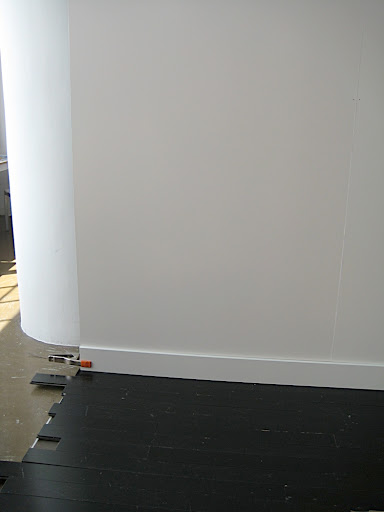 Here's the floor in place, in front of our lighter wall.