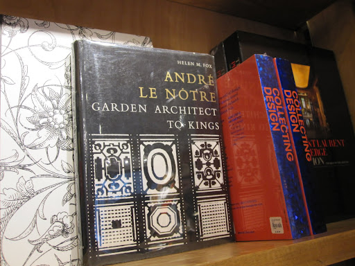 The shop has a variety of vintage books. They are displayed around the store, not just in one location.