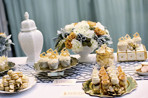 Items in the stunning dessert spread, complete with cupcakes, macarons, homemade marshmallows, and cookies, were adorned with metallic white chocolate or dusted in edible gold. Items in the stunning dessert spread, complete with cupcakes, macarons, homemade marshmallows, and cookies, were adorned with metallic white chocolate or dusted in edible gold.