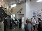 Art by students, graduates, faculty, and visiting artists covers the sunlit hallways.