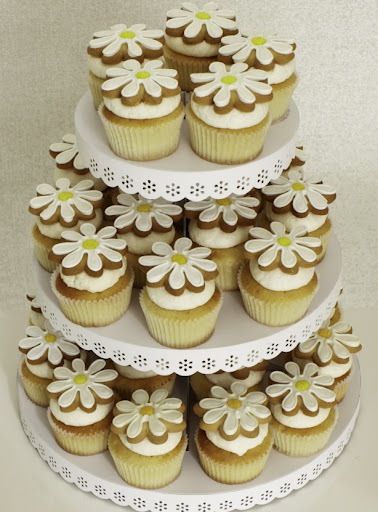 Here I put Eleni’s sweet daisy cookies (included in the sale) on top of vanilla cupcakes from Butterfly Bakeshop. You can stack your cookie-topped cupcakes on this Martha Stewart Crafts cupcake stand (included in this sale) or put out plates of the treats for your guests to nibble on. Here I put Eleni’s sweet daisy cookies (included in the sale) on top of vanilla cupcakes from Butterfly Bakeshop. You can stack your cookie-topped cupcakes on this Martha Stewart Crafts cupcake stand (included in this sale) or put out plates of the treats for your guests to nibble on.