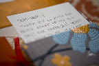 Handwrite a letter and slip it into a patterned fabric envelope to showcase its importance.