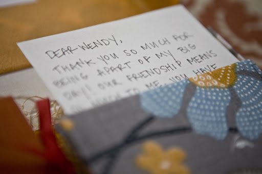 Handwrite a letter and slip it into a patterned fabric envelope to showcase its importance.
