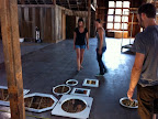 Discussing the layout for the framed mirrors.