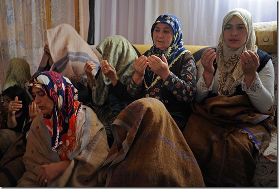 Women sit for a reading of the Koran late morning in the home of Murat Ozturk in the village of Alvar, Erzurum region, Turkey, which is traversed by the Baku-Tbilisi-Ceyhan oil pipeline, on the first day of Ramadan, August 11, 2010.
