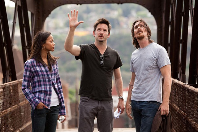 ( Left to right.) Star Zoe Saldana, Director Scott Cooper and star Christian Bale discuss a scene in Relativity Media's 