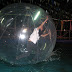 Eboi attempting to stand and walk on water inside the Zorb Ball