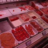 the butcher at the grocery shop in Seefeld, Tirol, Austria