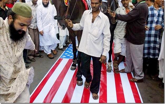 Muslims Walking on U.S. Flag Muslims Walking on U.S. Flag