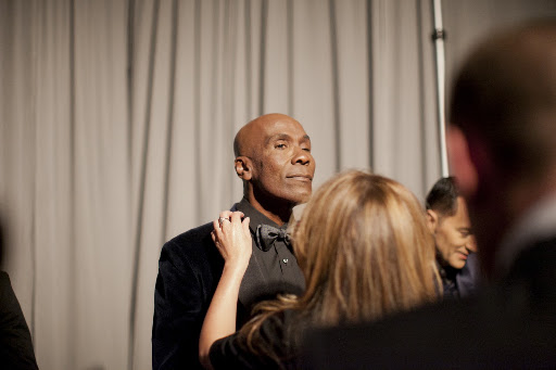 Reem Acra adjusting Preston's tie Reem Acra adjusting Preston's tie