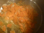 Onions, carrots, and rosemary softening in the pressure cooker..
