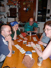 CM playing Fluxx --- The next night Code Monkey went to game night at Wunderland, the home of our friends the Looneys of Looney Labs (the game company that makes Fluxx and many other games). Here he is playing Fluxx with Alvaro, Alison, Andy, and Kristin.