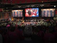 Team wins, pit crew hugging on giant projector