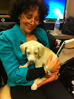 Foster mom and handler Jayne Vitale gets some Natasha cuddles before the show.