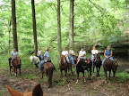 riders posing along Lusk Creek
