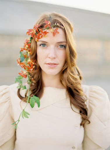Here, oncidium orchids and passion vine frame the face beautifully.
