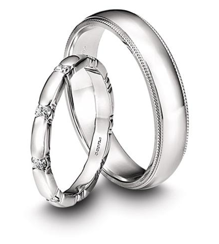 Memoire's Toujours Collection platinum wedding bands feature milligrain edging in the men's band and diamond accents in the women's style. We love that they work together without being too matchy-matchy! Memoire's Toujours Collection platinum wedding bands feature milligrain edging in the men's band and diamond accents in the women's style. We love that they work together without being too matchy-matchy!