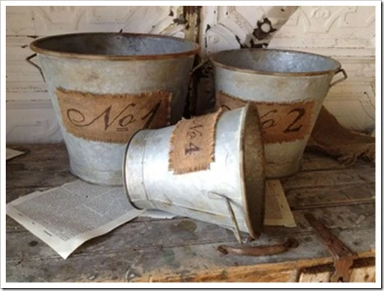 Rusty Metal Bucket with Burlap Patch