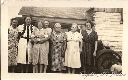 Ladies lined up Car may be a Dodge Tin Ceiling