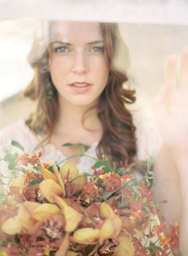Photographer Jose Villa shoots through the glass panes of the greenhouse.