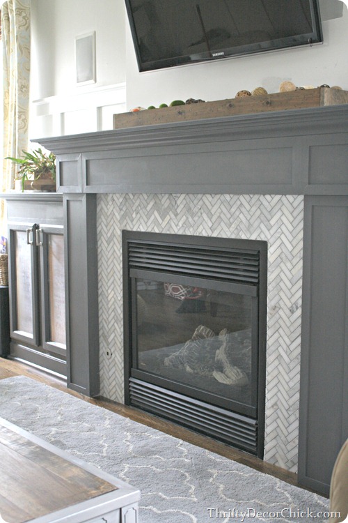 herringbone tile gray fireplace
