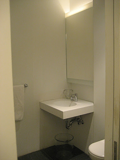 A powder room is located off the main hallway.