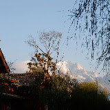 Lijiang - sunrise on mountains from the streets