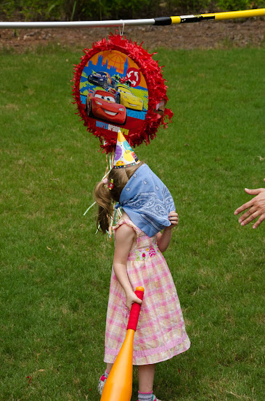 Sam didn't really get the idea of covering her eyes to hit the pinyata