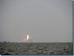 7974  private boat charter with Capt. Ron Presley  and his wife Karen - Banana River, Florida - Kennedy Space Center - Atlantis blasts off marking final NASA shuttle launch