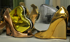 Two Fendi bags (http://www.fendi.com), hopped into a few Jimmy Choos, (http://www.jimmychoo.com/).