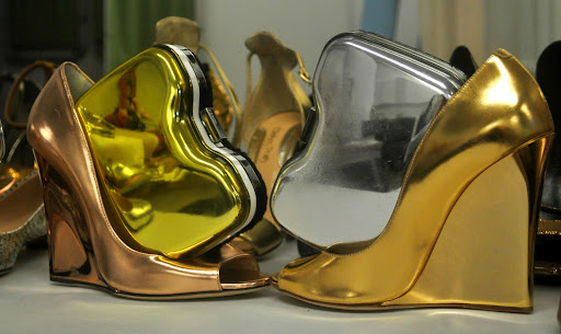Two Fendi bags (http://www.fendi.com), hopped into a few Jimmy Choos, (http://www.jimmychoo.com/).