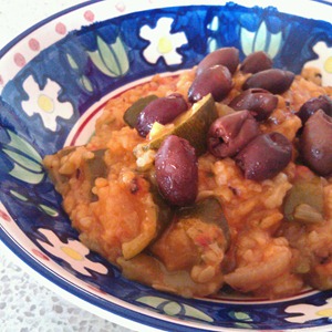 Courgettes with Rice served with olives.