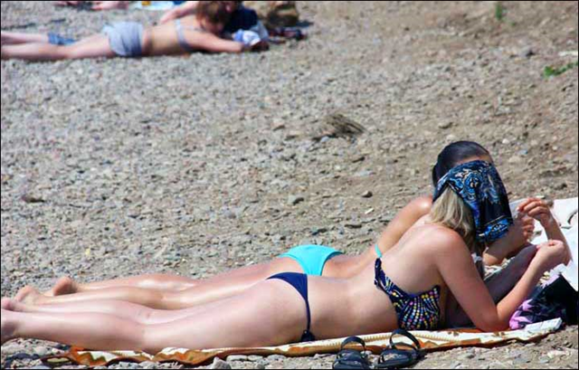 Norilsk - above the Arctic Circle - is known as one of the world's coldest cites, and is built on permafrost. This sunbathing picture was taken around Lake Baikal on 24 July 2013. Photo: The Siberian Times