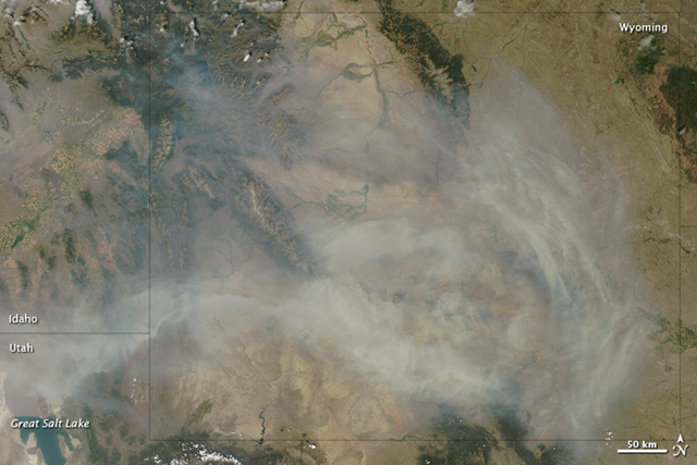 Wildfires in California, Oregon, Idaho, and Nevada sent smoke over large stretches of the United States in mid-August 2012. Particularly thick smoke collected over Wyoming on August 14, when the Moderate Resolution Imaging Spectroradiometer (MODIS) on NASA's Terra satellite captured this natural-color image. Smoke filled the skies over most of the state; over the south-central part of the state, it was thick enough to completely hide the land surface below. NASA image courtesy Jeff Schmaltz