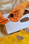 To make the flowers even larger, Ana makes and secures individual petals onto their own stems.