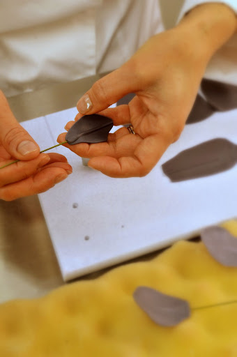 To make the flowers even larger, Ana makes and secures individual petals onto their own stems.