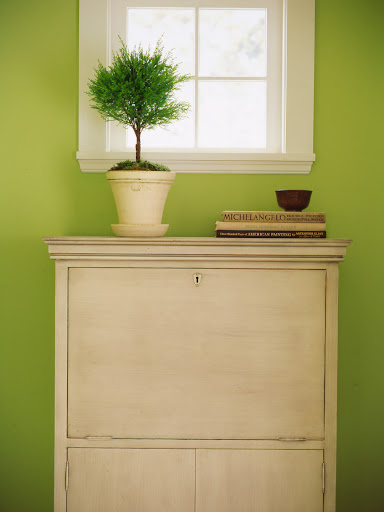 A secretary desk is perfect for a narrow hallway, as you can fold up your work space when it is not in use.