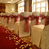 Ceremony room - chair covers and scattered petals.jpg