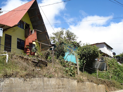 Monteverde is very hilly.  Steeply hilly.  The houses were only three feet away from the road on a horizontal axis, but the grade of the hill was such that they were also 10 feet up.