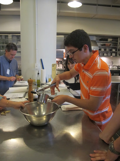 Nicholas uses a potato ricer for the first time to make gnocchi