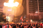 Flames lighting the crowd at one of Robson Square's nightly fireworks celebrations