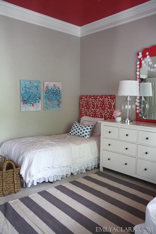 Teal & coral kids bedroom with abstract paintings