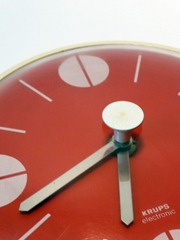 red Krups wall clock