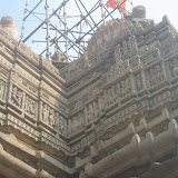 Tiers on the roof are carved with dancers, musicians and couples in various postures.