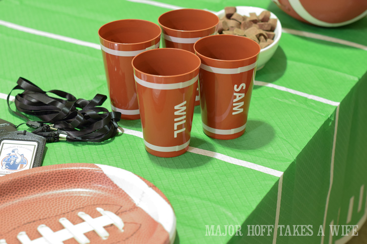 Personalized football cups. Looking for a fun party for your teenage boy? Why not throw a Football video game party? Easy ideas for how to entertain kiddos during the Big Game. Features DiGiorno pizza, personalized football cups, free printable lanyards, and an incredible recipe for football shaped ice cream sandwiches! #GameTimeMVP #CollectiveBias #ad Personalized football cups. Looking for a fun party for your teenage boy? Why not throw a Football video game party? Easy ideas for how to entertain kiddos during the Big Game. Features DiGiorno pizza, personalized football cups, free printable lanyards, and an incredible recipe for football shaped ice cream sandwiches! #GameTimeMVP #CollectiveBias #ad