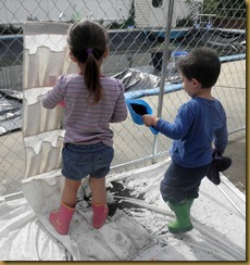 Sophia and Cohen planting herb garden