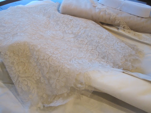 Steven went to NYC's garment district to source the fabric. He purchased 1950s vintage lace, silk peau de soi, tulle, and all of the necessary materials for the gown.