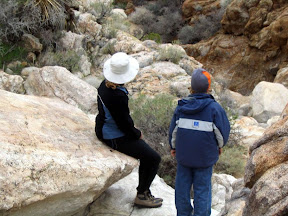 Mary and Kai contemplate the best approach to descend into the canyon.