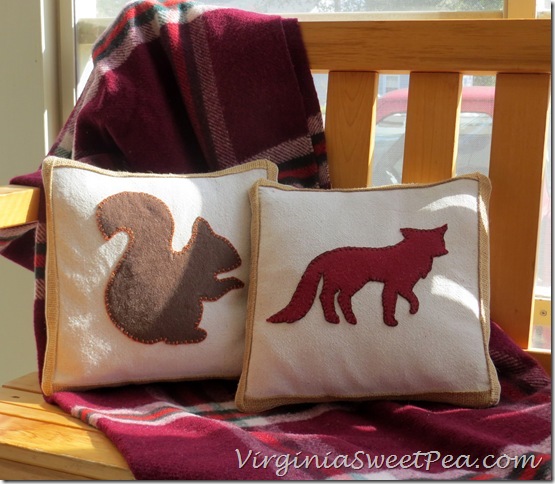 Squirrel and Fox Pillows on Porch