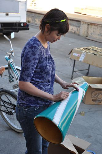 We found this megaphone at the flea market and thought it would be a brilliant prop to be used by Tom, Daniel's best man, to make announcements (very circus side show). It was plain white, so we spray painted it with teal stripes and decorated with silver pinstriping tape (meant for detailing cars).
